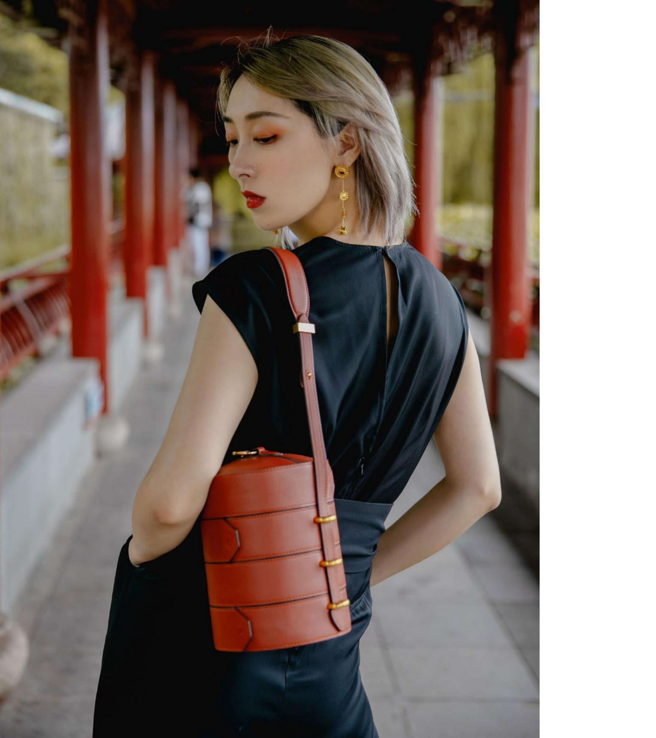 LAOGUI Studio bamboo steamer bag worn as a Chinese-inspired leather accessory