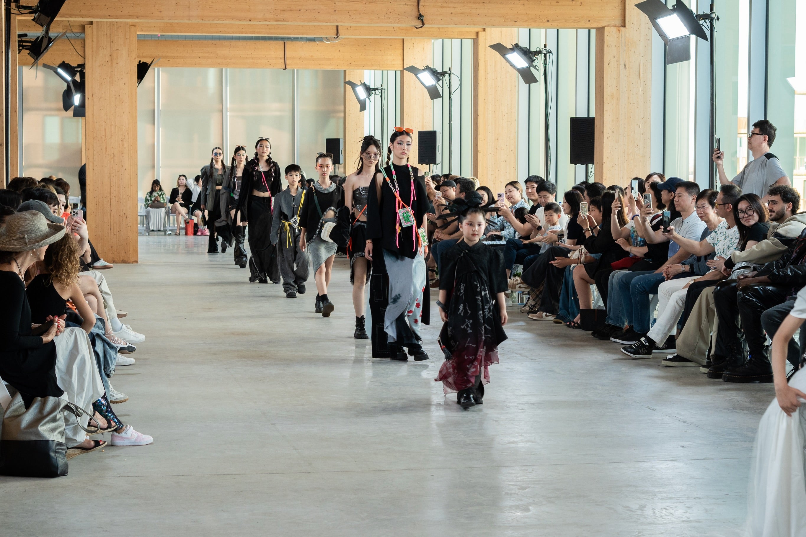 Runway lineup with audience watching the LAOGUI and uniQverse Fashion Art Toronto presentation