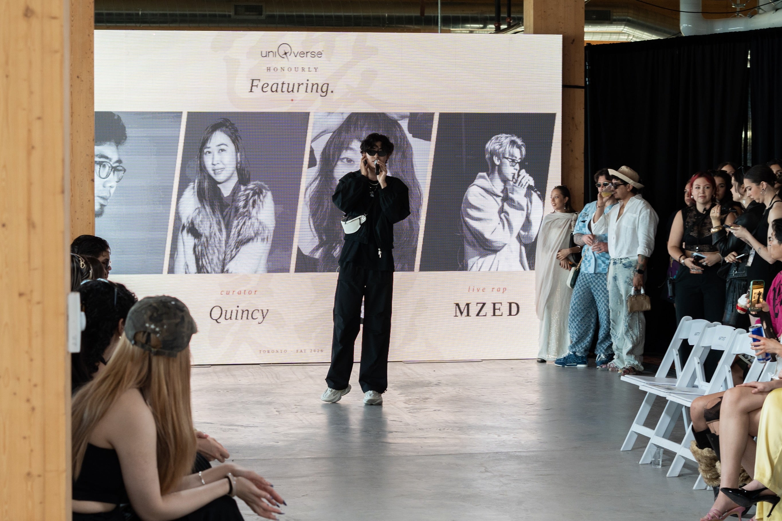 uniQverse Fashion Art Toronto stage moment with live performer and models