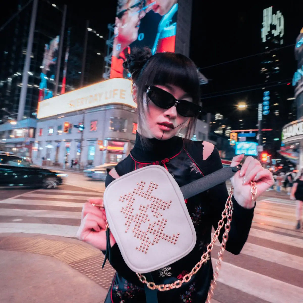 LAOGUI model wearing a statement bag at night